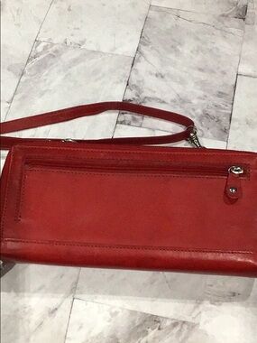 red wallet on strap